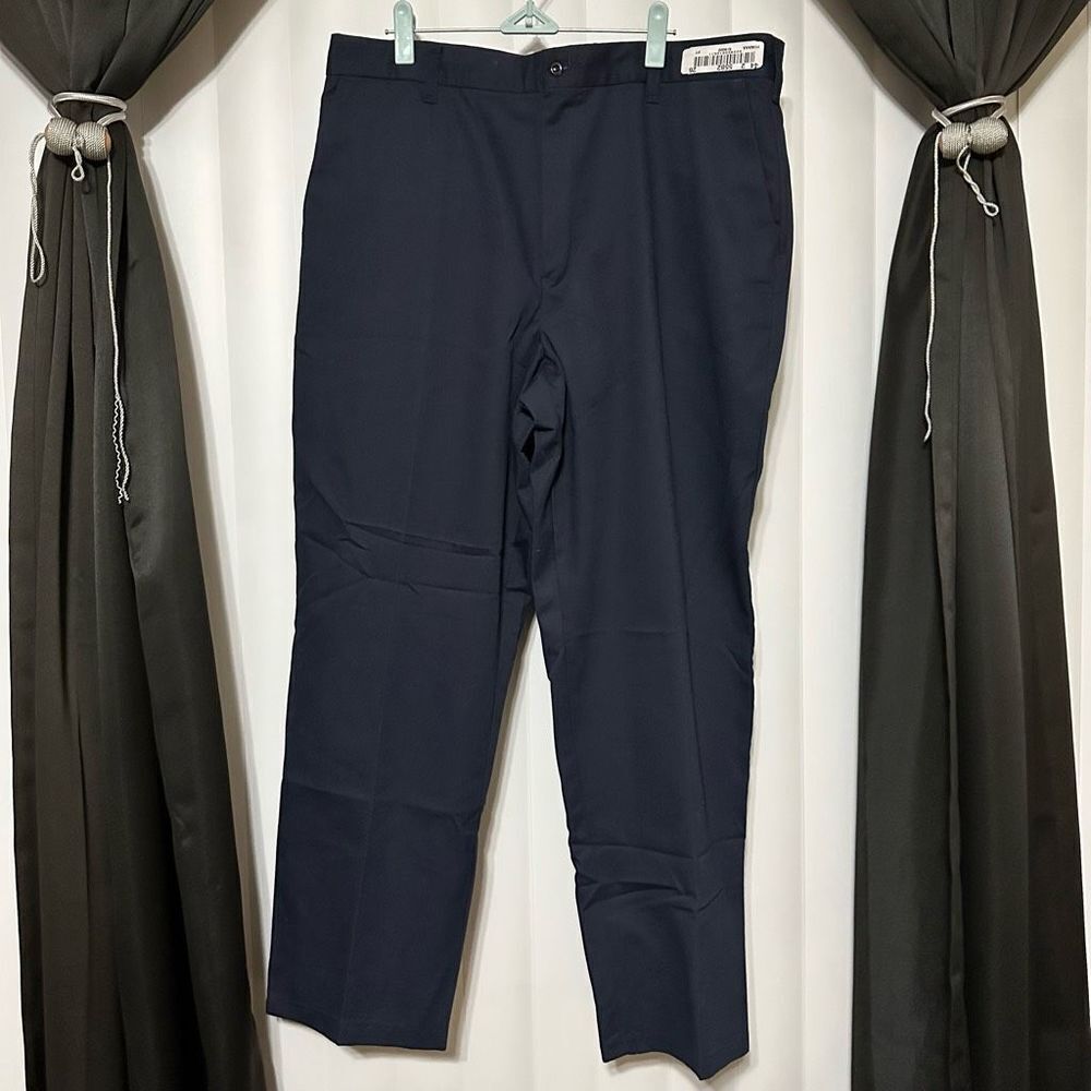 Navy blue slacks , zipper front with button , 2 frontal pockets, 2 back pockets